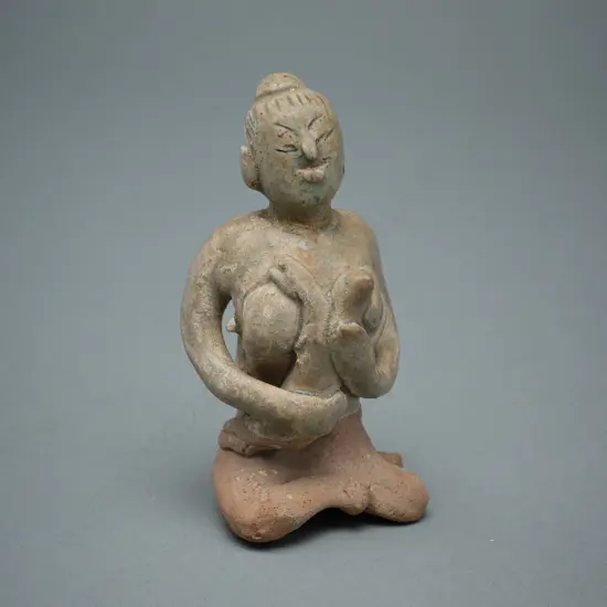 A Sawankhalok stoneware figure (tukatha),